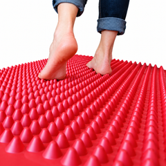 Person walking barefoot along an Acupro Acumat® sensory walkway for tactile input, balance and sensory-motor exploration
