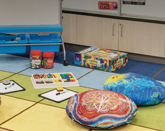 Indigenous artwork floor cushions used in a classroom play corner