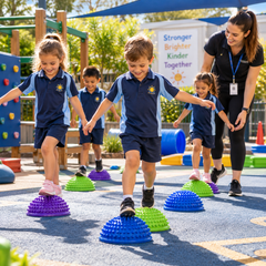 Acupressure Stepping Pods helping children develop balance, coordination and sensory skills in an outdoor school setting.