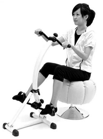 Lady seated using the Arm and Leg Exerciser