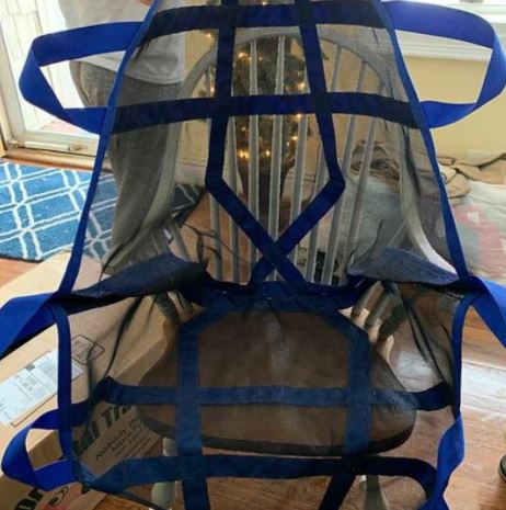 Rescue Perfect Lift with blue straps spread out on chair