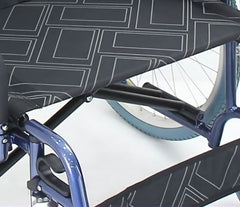 This is an image of the Oversized Bariatric Manual Wheelchair  self -propelled - 250kg Weight. It is an image of the seat with a geometric pattern and blue wheels.