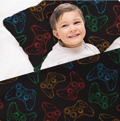 Boy in bed with Gamer pattern on compression bed sheet and pillow case