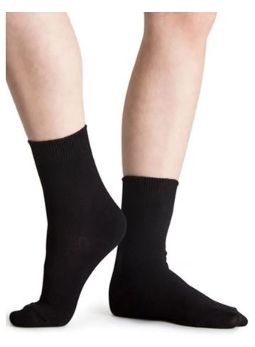 Man's legs wearing black Calmcare sensory socks