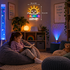 Child seated in a calming area on a bean bag, reading a book with a calming corner sign on the wall behind.