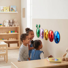 Children using bubble mirrors in a classroom.