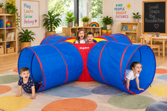 Crawling Cross Tunnel 4-way activity tunnel with children crawling through it in a colourful early learning classroom