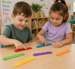 Two preschool children explore colourful Textured Fidget Strips at a classroom table, using the tactile surfaces for quiet sensory play, focus and fine motor engagement.