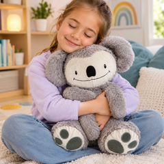 Child hugging Koko the Koala weighted sensory companion for calming, sensory regulation and emotional support.