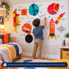 Young boy  in his bedroom using the Magnetic Marker Wall Decal which supports creative play, home learning, fine motor skills and interactive learning.