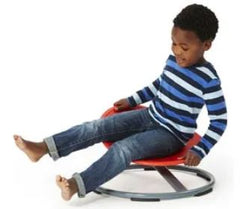 Boy rotating on red 56cm Balance Disc