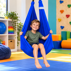 Child sitting in a blue Lycra therapy swing