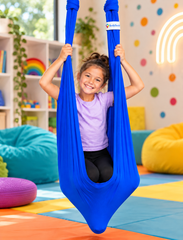 Child standing in a blue Lycra therapy swing