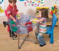Two children playing at the Circular Stand and Water Tray filled with water and floating toys