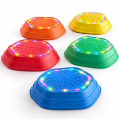 A set of five colorful light-up stepping stones in orange, yellow, green, red, and blue.