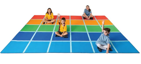 Young students sitting on the Fun Colour Blocks classroom rug with 30 colourful seating rectangles in primary colours, large 4m x 3m educational rug for structured classroom seating and group learning