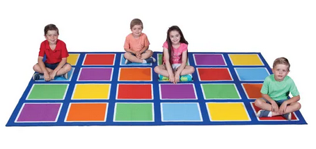 Children sitting on the Colour Placement Rug with 24 bright squares in a 3m x 2m classroom seating layout