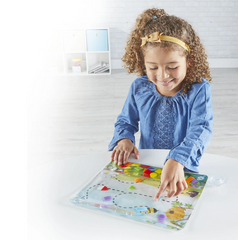 Child using Colours & Shapes Sensory Pad to develop hand-eye coordination