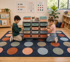 Two children are kneeling on a Colors of Australia square floor rug decorated with circles.