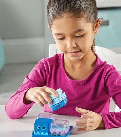Child playing with he Cool Down Cubes Sensory Fidget Set featuring four interactive self-regulation cubes with squeeze, spinner, maze and falling beads activities for emotional regulation, focus and therapy support.
