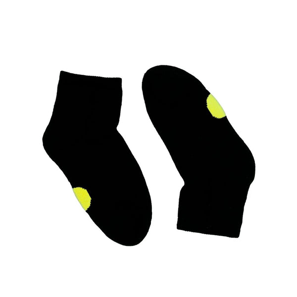 Pair of Dot on a Sock black quarter crew socks with yellow dot on soles