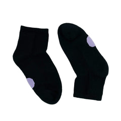 Pair of Dot on a Sock black quarter crew socks with purple dot on soles