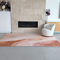 Clay Drift Memory Foam Mat with 35mm high-resilience foam, non-slip base and organic clay, blush and terracotta pattern in a lounge setting with fireplace