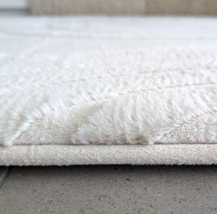 Close up of the edge of the vanilla cream Cloud Haven Soft Touch Mat