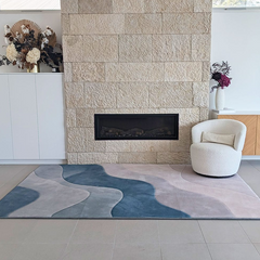 Ocean Dune Memory Foam Mat featuring a flowing organic pattern in deep ocean blue, misty grey, soft blush and warm neutral tones.