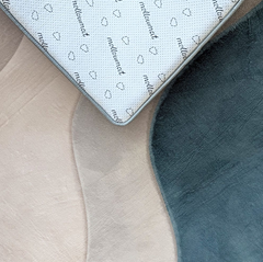 Close up of the non-slip backing of the  Ocean Dune Memory Foam Mat providing a generous cushioned floor area for relaxation and shared activities.