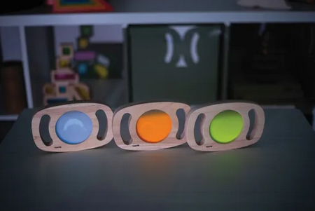 Three wooden framed Easy Glow Hold Panels with glowing baubles of blue, orange, and green.