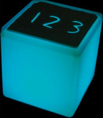 Activity sheet on a blue lit Extra Bright rechargeable LED light cube for sensory learning and educational activities