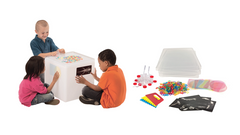 Children playing with an Extra Bright Light Cube and 268-piece accessories kit for sensory STEM learning