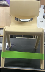 Front view of lime green coloured  Fidget Chair Band stretchy sensory band attached to a classroom chair to support seated movement, focus, sensory regulation and calm during learning and therapy activities