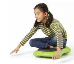 Child sitting on green floor surfer