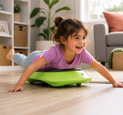Child enjoying active play on a green Floor Surfer in a bright home setting.