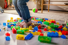Child safely stepping on a pile of Jelly Blox 