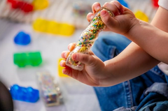 Child easily twisting a Jelly Blox 