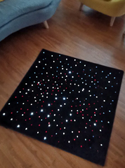 LED Sensory Carpet 95cm with illuminated fibre optic strands on a floor.