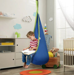 This is an image of a child sitting in a Blue Kids Hanging Pod. The child is reading a book.