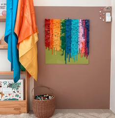 A cocoa coloured Magnetic Chalk Wall Decal used as a wall-mounted magnetic building and creative play surface in a children's playroom.