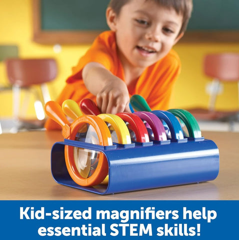 Child playing with colorful magnifiers in a classroom setting