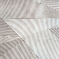 Close-up of the Dusty Facet mat’s textured geometric pattern in soft neutral tones.