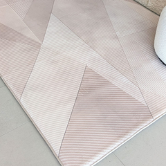 Dusty Facet memory foam mat showing stitched edging and geometric print.
