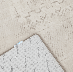 Close-up of the Sandstone mat showing its non-slip backing and finished corner edging.