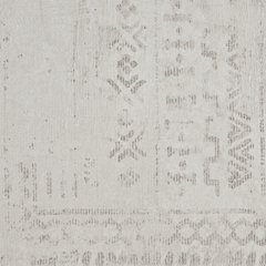 Detailed view of the soft beige, distressed stone-washed pattern and subtle geometric markings.