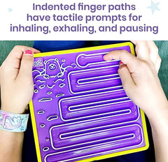 A young child's finger traces the maze on a purple Mindful Maze board