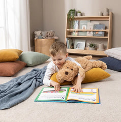 Mini & Me Weighted Plush Puppy with child reading on floor