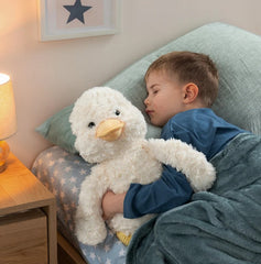 Mini & Me Weighted Plush Duck hugged by child