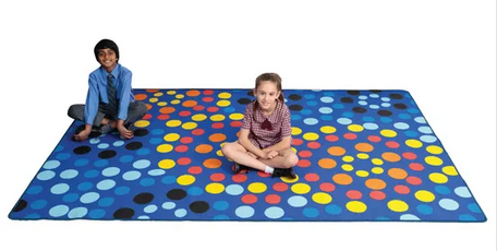 Two young students sitting on the Mosaic Sky classroom rug 3m x 2m for reading corners, mindfulness spaces, quiet learning zones, and early childhood classrooms